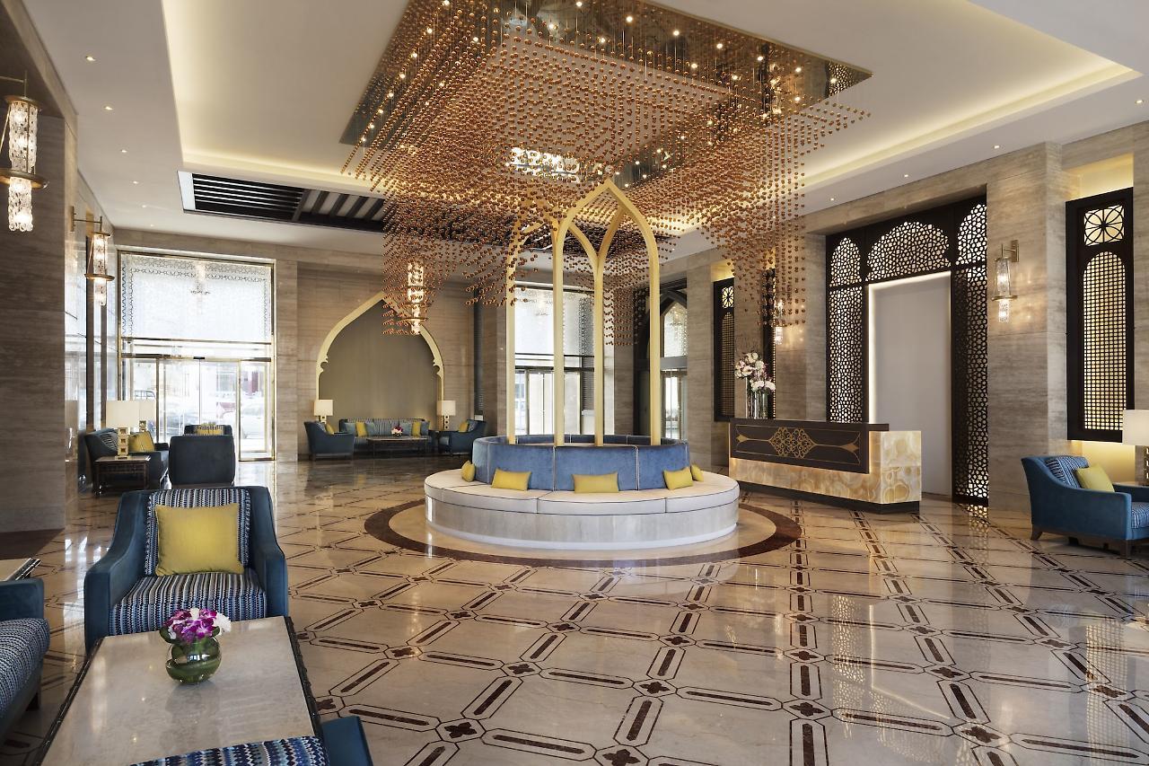 โรงแรมอัล นาจาดา โดฮา บาย ทิโวลี ภายนอก รูปภาพ The lobby of the hotel